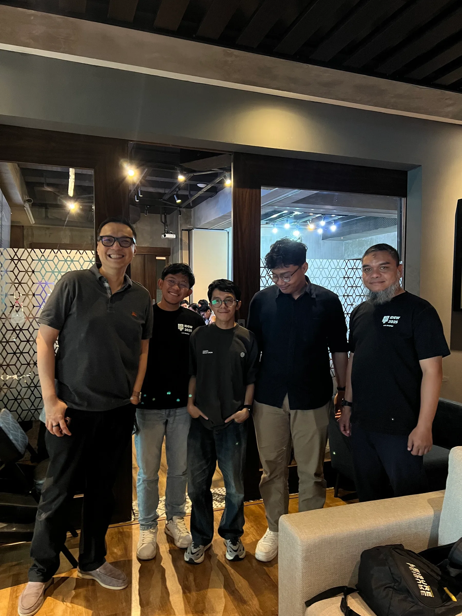 Five participants posing together at the Codex Build Week event