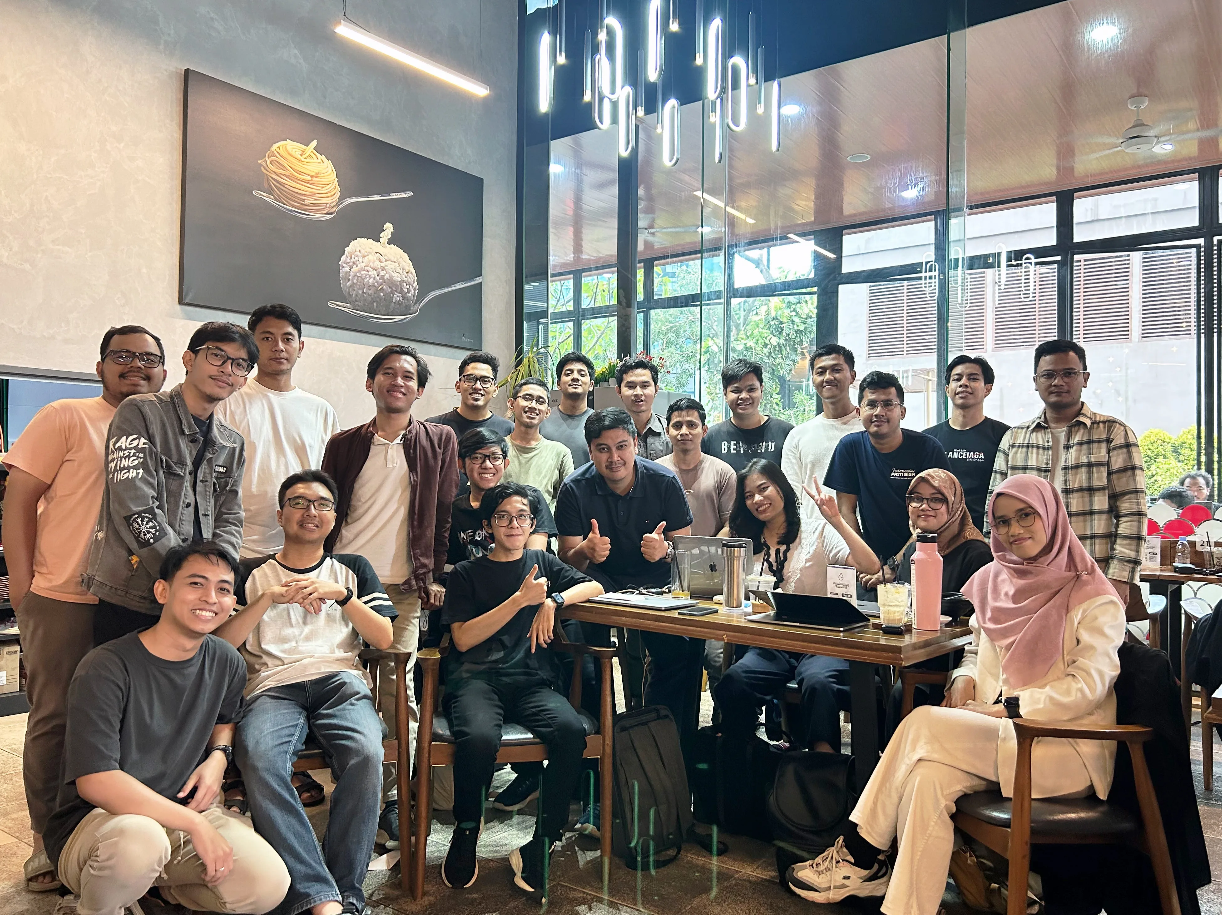 Community members together around a table in a cafe